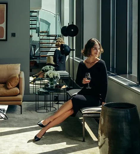 woman-sitting-by-window-smiling
